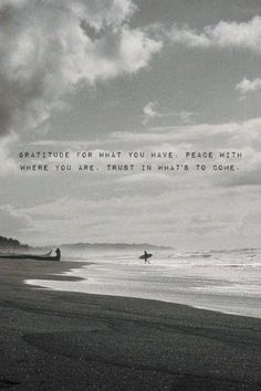 a man walking on the beach with a surfboard under his arm and an inspirational quote above him