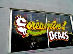 there is a window that has the words sequina and dealers written in it