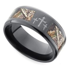 the camo wedding band is shown in black ceramic with an etched cross on it