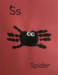 handprinted spider on pink paper with the letters s and s in black ink