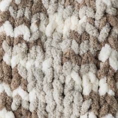 the carpet is made up of many different colors and sizes, including white, brown, and black