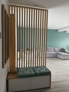 a living room filled with furniture and wooden slats