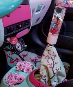 the interior of a car with pink flowers in it