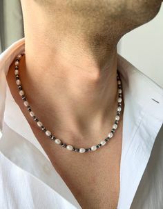 Mens Pearl Necklace, Waterproof Necklace, Non Tarnish Necklace, Real Pearl Necklace Men, Gifts for Men, Birthday Gift for Him, y2k Necklace, y2k Jewelry, Mens Necklace, Freshwater Pearl Necklace, Necklace for Men, Hematite Necklace, Mens Gold Necklace ♥ Useful Quick Notes * This product is prepared with ivory freshwater pearls and shiny hematite stone beads. * The finish is made with a stainless steel lobster claw. * Length: We offer 2 options: 1. 48.5 cm(+-1) - 19.1 inch(+-0.4)  2. x cm(+-1) - x inch(+-0.4) You may choose free chain extension (5 cm - 2 inch) **The length may have difference up to 1 cm - 0.4 inch due to the natural shapes of the pearls. * Metal parts are made of stainless steel.  * For longer lasting use, it is recommended to keep this handmade product away from heavy chem Guys With Pearl Necklace, Pearl Necklace Outfits, Men In Pearl Necklace, Pearl Necklace Boy, Bead Necklace Men, Male Pearl Necklace, Men’s Pearl Chain, Mens Real Pearl Necklace, Gifts For Men Birthday