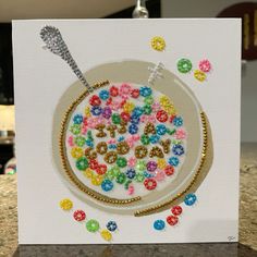 a birthday card with beads and a spoon