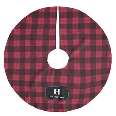 a red and black plaid pattern with the h logo on it's center circle