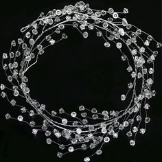 PRICES MAY VARY. PACK OF 4 STRINGS: Each Diamond Ice Wire Clear Plastic Branch Garland measures approximately 5 feet (1.5m) long, 20 foot (6m) in total. Branch Length: 5ft /150cm, Stem Length: 5" /12.5cm, Each branch has 45 stems, each Stem has 4 shining diamond ice beads, and one branch has 180 transparent diamond ice beads in total. CLEAR ACRYLIC PLASTIC PREMIUM QUALITY: Made of plastic and steel metal wire, flexible wire stems and bendable wire branch, lightweight, very sturdy durable and reu Winter Wonderland Home Decor, Branch Garland, Garland Christmas Tree, Winter Wonderland Decorations, Crystal Garland, Christmas Diamonds, Ornament Garland, Diamond Ice, Garland Christmas