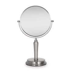 a round mirror sitting on top of a metal stand in front of a white background