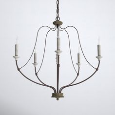 a chandelier with five candles hanging from it