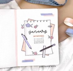 a notebook with the word january written on it