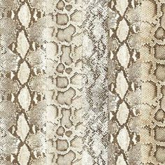 a snake skin pattern with different colors and patterns on the fabric, including white and brown