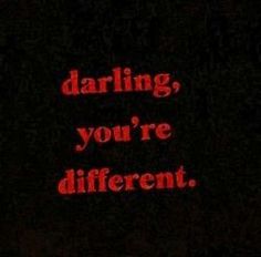 the words daring, you're different written in red on a black background