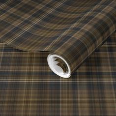 a brown and black plaid wallpaper with white trim