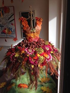 a dress made out of flowers and leaves