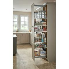 an open pantry door in the middle of a kitchen