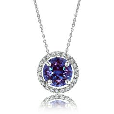 This JeenMata Solitaire 1.25 Carat Round Cut - Alexandrite - June Birthstone Halo Pendant Necklace in White Gold Plating, Adult, Female would make a beautifully unique gift for any special occasion. Hanging in an 18-inch cable chain that is secured by a spring ring clasp, this handmade necklace features 1 carat round cut real cubic zirconia and 0.25 carat high quality cubic zirconias for a total weight of 1.25 carat. Crafted and designed by our passionate jewelry experts, this affordable pendant Alexandrite Necklace, Cubic Zirconia Necklace, Halo Pendant, June Birthstone, June Birth Stone, Perfect Gift For Her, Handmade Necklace, 1 Carat, Spring Rings