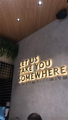 a neon sign that says let us take you somewhere