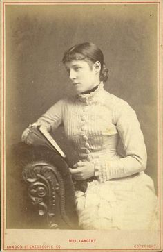 an old photo of a woman holding a book