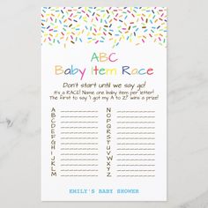 a baby shower game with sprinkles on the front and back, in rainbow colors