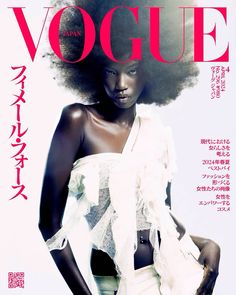 a woman with an afro is featured on the cover of a magazine, wearing a white top