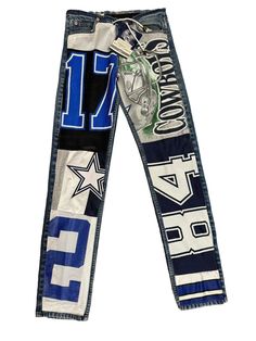 Show your love for the Dallas Cowboys with this vintage jersey patchwork jean. The design makes it perfect for any National Football League (NFL) fan. Get ready to cheer on your favorite team, and stand out from the crowd with this unique Dallas Cowboys jersey pant. The jeans still have the tag from the Cowboys Stadium Pro Shop. They are made with orange tabbed Levi's and have a spot that has been reinforced on the back. They have spots where the jeans need to be Fray Checked or stitches added due to loose thread. Don't miss out on these one of a kind pair of jeans. Shipped priority mail with insurance. Straight Leg Mid Rise Inseam: 33" Front Rise: 10" Waist: 30" around the entire waist Leg Opening: 13.5" around the entire leg opening Football Pants Design, Jeans Patchwork Fashion, Jersey Patchwork, Cowboys Stadium, Cowboys Jersey, Vintage Dallas Cowboys, Dallas Cowboys Jersey, Cowboy Pants, Patchwork Fashion