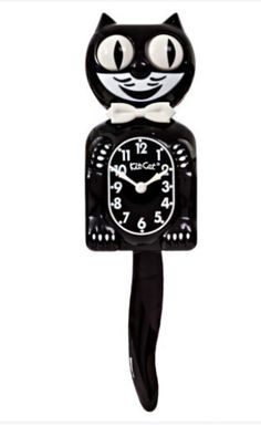 a black clock with a cat face on it