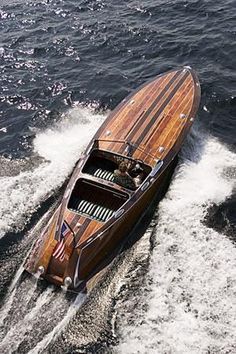 a small wooden boat in the water