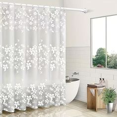 a bathroom with a tub, sink and shower curtain in white color on the wall