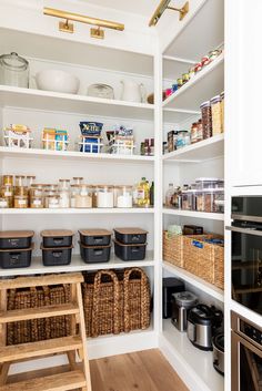 an organized pantry with baskets and food items