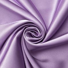 a close up view of a purple satin fabric