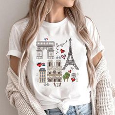 Hello, thanks for visiting Violeta's Shop! ♥ Paris Tshirt, Travel T-Shirt, Eiffel Tower TShirt, Women Paris Shirt, Paris Travel, Gift Paris, France **PLEASE review the sizing charts before ordering - measuring is always the best idea! --- Details --- UNISEX TSHIRT essential fits like a well-loved favorite. Super soft cotton and excellent quality print make one to fall in love with it over and over again. ♥ Retail fit ♥ 100% Soft cotton (fibre content may vary for different colors) ♥ Light fabric Paris Shirt Ideas, Travel Tshirt Design Ideas, Belgium Trip, Paris Tshirt, Comfortable Travel Outfit, Paris Tee, Travel Tshirt, Paris Shirt, Disney Paris