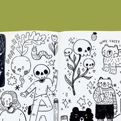 an open book with black and white drawings on it's pages, including skulls