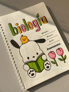 a notebook with an image of a dog and flowers on the cover, which reads biologia