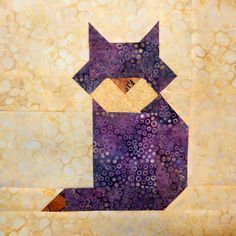 a purple cat sitting on top of a piece of paper with circles all over it