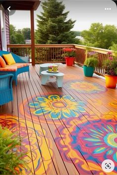 an outdoor deck painted with bright colors and potted plants