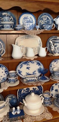 blue and white china on display in a store