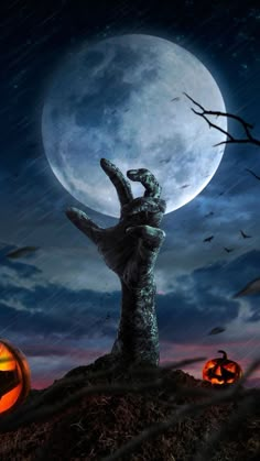 an image of a creepy hand coming out of the ground with a full moon in the background