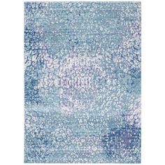 a blue and white rug with an abstract design on the bottom, it is very soft