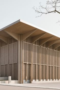 the building is made out of wood and has vertical slats