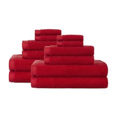 six red towels stacked on top of each other in front of a white background,