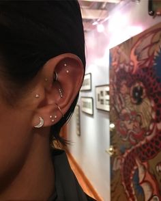 a woman with ear piercings on her ears