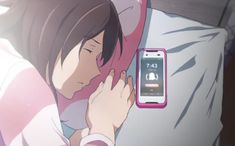 an anime character holding up a cell phone