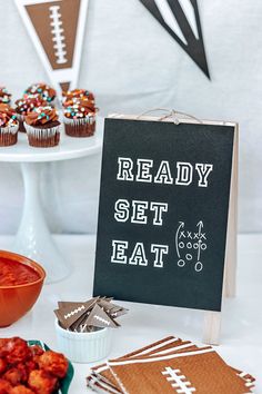 a football themed party with cupcakes and snacks