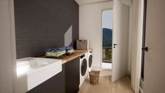 a washer and dryer in a bathroom next to a window with mountains in the background