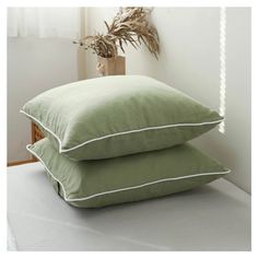 two pillows sitting on top of each other