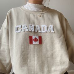 This cute Canada Sweatshirt is the perfect gift to Canada lovers! - Material is super soft and comfy! ♡ - All our sweatshirts run a Unisex fit. They are naturally oversized, but if you like a more baggy look, we recommend sizing up. - These letters are iron-on patched and is heat pressed, not embroidered. - Please note that crewneck brand used may vary depending on what our supplier has, therefore sizes and dimensions might also vary by a little bit. (Hanes, Gildan, Jerzees) Please be mindful th Canada Day Outfit, Canada Outfit, Canada Sweatshirt, Canada Clothing, Outdoorsy Outfits, Canada Shirt, Canada Clothes, Cool Shirt Designs, Brown Sweatshirt