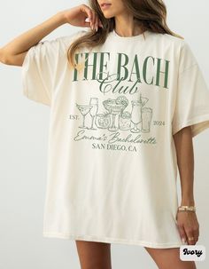 "The Bach Club Shirt, Custom Location Bachelorette Shirt, Personalized Bride Shirt, Future Bride Shirt for Bridal Party, Bridesmaid Proposal Tees, Personalized Last Toast on the Coast Bachelorette Shirt, Classy Cocktail Themed Comfort Colors Beach Bachelorette Party Shirts, Comfort Colors Nautical Bridal Shower Shirt, Social Club Bach, Tropical Bach Merch ✧ WHY  YOU'LL  LOVE IT ✧  ⋒ Comfort Colors® tees are garment-dyed shirts that are timeless classics and will never pile.  ⋒ Trendy retro vinta Club Bachelorette Party Ideas, Beach Bridal Party Gifts, Bach T Shirt Ideas, Pismo Beach Bachelorette Party, Party Personalized Ideas, Bachelorette Weekend Shirts, Bachelorette Beach Club Theme, Bach Outfits For Bridesmaids, Bachelorette Party Necessities