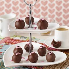 there are chocolate truffles with pink hearts on them