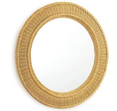 a round mirror made out of wicker on a white background with clipping for text