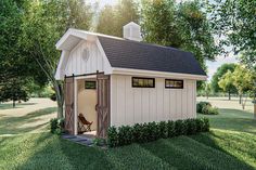 Work from home in this farmhouse-inspired backyard office plan.  The exterior features a gambrel roof and board and batten siding.  A set of sliding barn doors opens to a large office space that is perfect for working remotely from home. Large Office Space, Modern Farmhouse Backyard, She Shed Office, Farmhouse Sheds, Barn Style Shed, Shed With Loft, Farmhouse Backyard, Backyard Barn, Cottage Studio